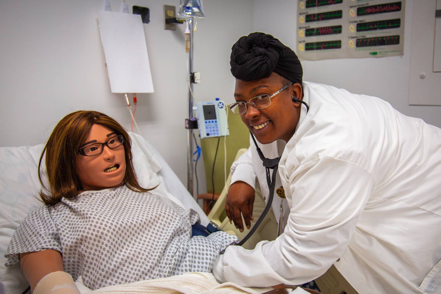female nursing student attending to a patient
