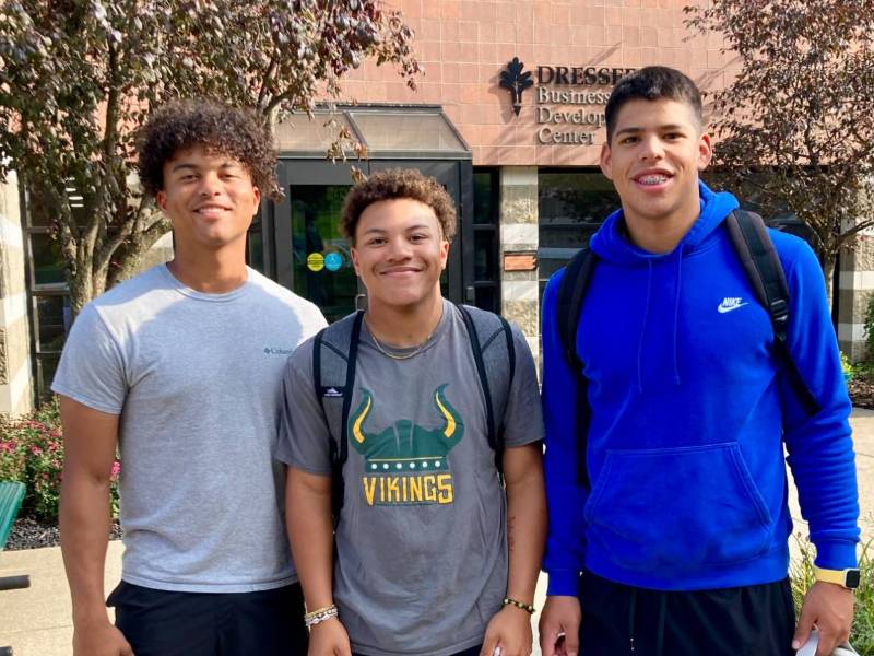 male students standing outside Glen Oaks main campus