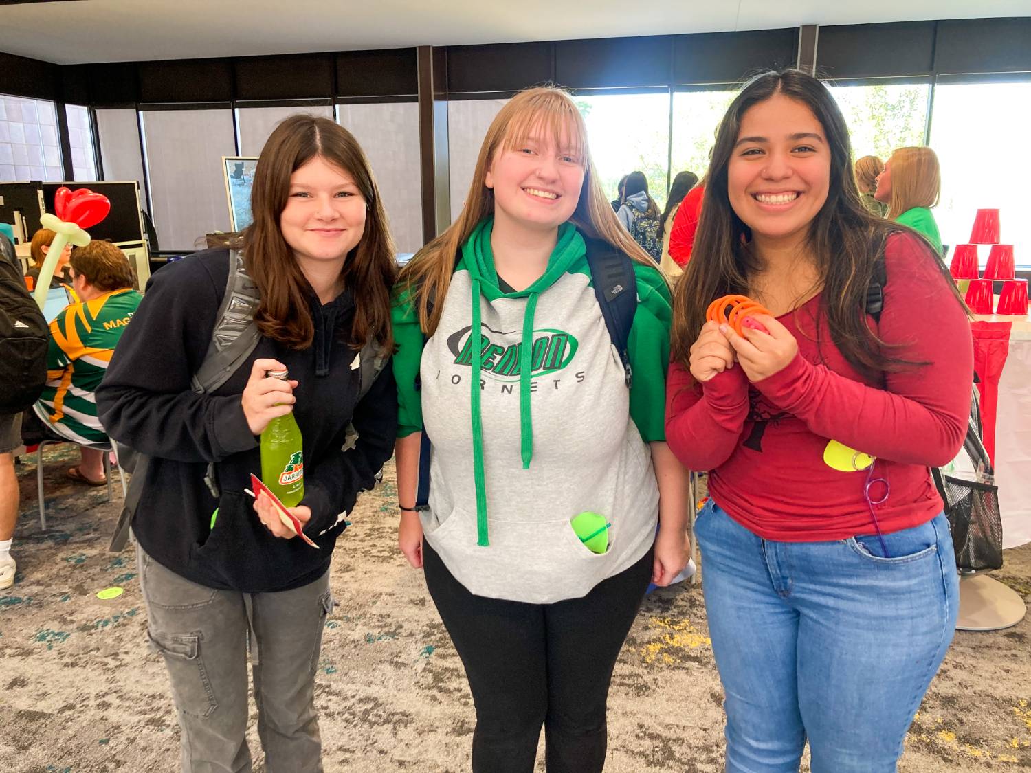 3 female friends posing for the camera